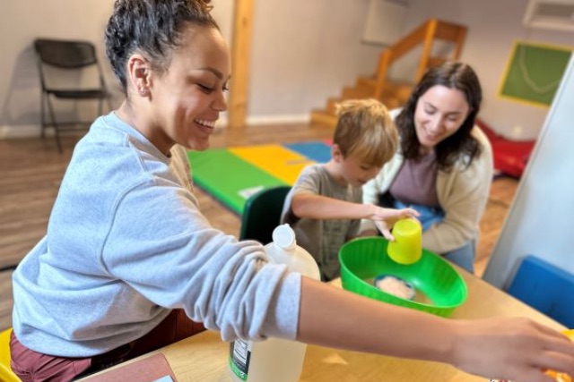 A KidWorks therapist working with a child
